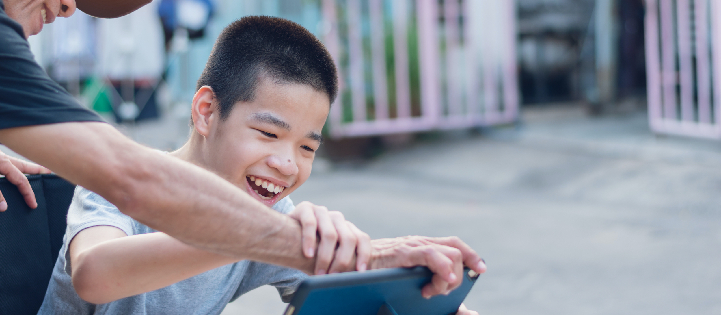 Disabled child on wheelchair happy time to use a tablet in the house, Study and Work at home for safety from covid 19, Life in the education age of special need kid, Happy disability boy concept.