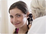 Girl Getting Ear Checked by Doctor Image